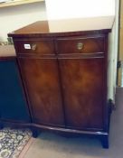 A 2 drawer 2 door mahogany cabinet
