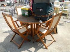 A table, chairs and parasol