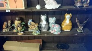 A shelf of china animals