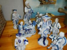 A quantity of blue and white china figures