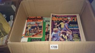A box of Shoot magazines etc.