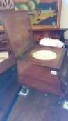 A mahogany commode