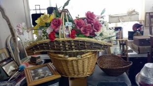 A quantity of flowers in baskets