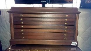 A specimen chest of 7 small drawers coin chest