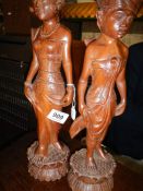 A quantity of old wooden figures
