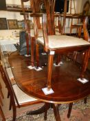 A mahogany dining table and 6 chairs
