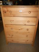 A pine 5 drawer chest of drawers