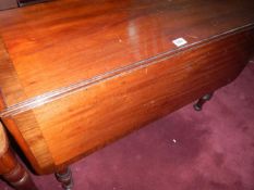 A Victorian cross banded Pembroke table