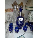 A claret jug and other glassware