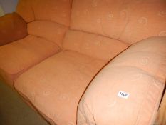 A 2 seater pink settee