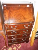 A 4 drawer mahogany desk