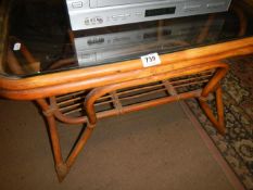 A bamboo table with glass top