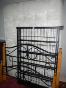 A 4' 6'' metal bedstead and matress