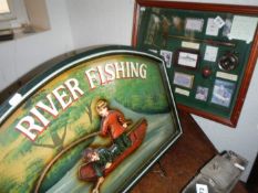 A cased fishing display cabinet including reels, flies etc and a advertising board