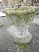 A concrete garden urn