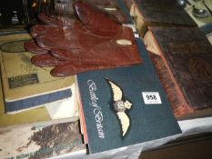 A quantity of books and pair of leather gloves