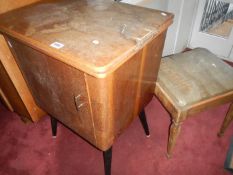 An old sewing machine and stool