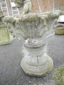 A concrete garden urn
