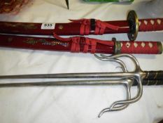 2 small Samurai swords and 2 other weapons