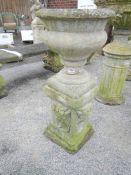 A garden urn on plinth