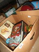 2 boxes of collectors tins and a Jack Daniels games set