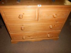 A 2 over 2 chest of drawers