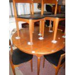 A teak table and 6 chairs