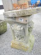 A concrete garden plinth