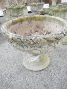 A large concrete garden urn