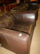 A leather settee and armchair