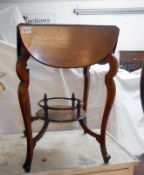 A mahogany side table with drop leaves & under gallery