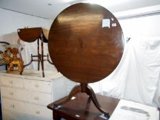 A 19th century mahogany tripod tip top tea table