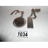 Silver ingot with silver chain and a 1977 silver jubilee crown in silver mount with chain
