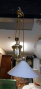 A brass French style rise and fall lamp
