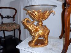 A large gilded elephant comport with glass bowl