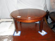 A mahogany inlaid cut down table