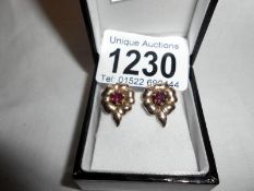 Ruby earrings set in rose gold