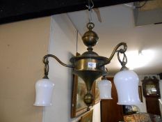 A brass 3 arm ceiling light