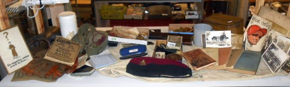 A quantity of Militaria including buttons, WW2 medals, dummy rifle, hats, gloves,