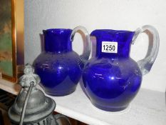 Pair of large Bristol blue glass jugs