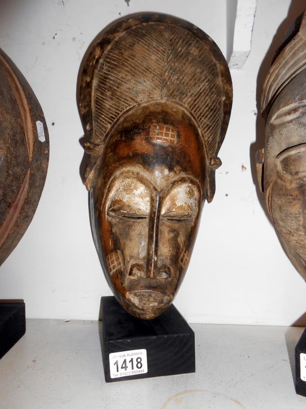A Yoruba ceremonial mask from South West Nigeria approx 38 x 19 x 9.