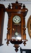 A wall clock with key and pendulum