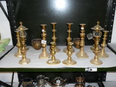 6 pairs of brass candlesticks and 2 brass pots