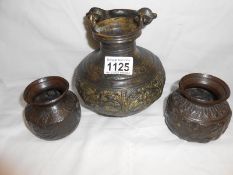 A heavy 20th century cast bronze pot and a pair of 20th century small bronze pots