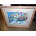 A watercolour of flowers in baskets signed M Barton