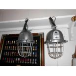 A pair of heavy aluminium industrial style lamps