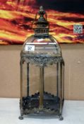 A metal and glass garden lantern