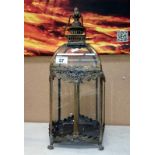 A metal and glass garden lantern