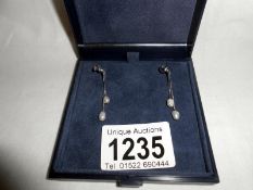 Pair of pendant earrings in 18ct white gold set with pearls