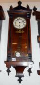 A mahogany case wall clock